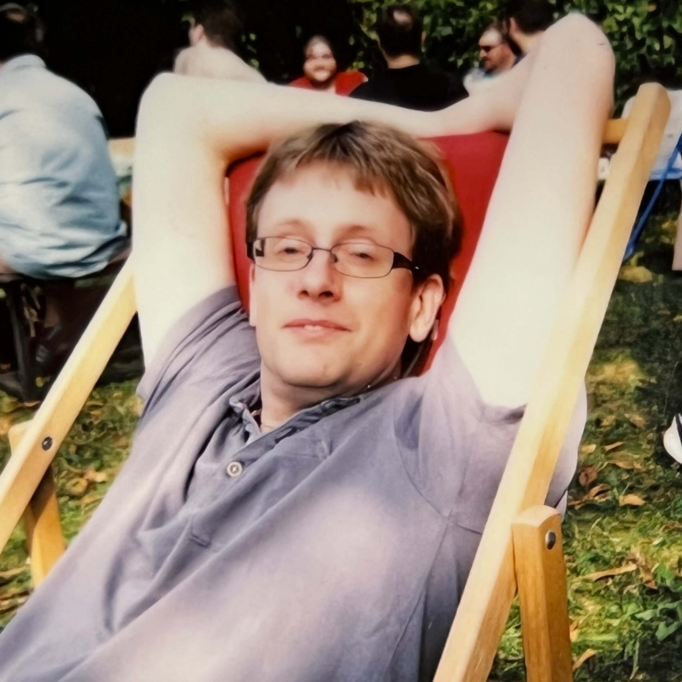 A Keen employee relaxing on a deck chair
